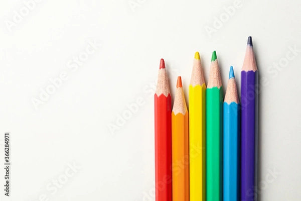 Fototapeta Colored pencils on white background, space for text