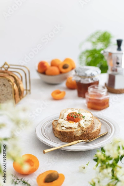 Obraz Beautifully served summer breakfast with toasted bread and homemade apricot jam