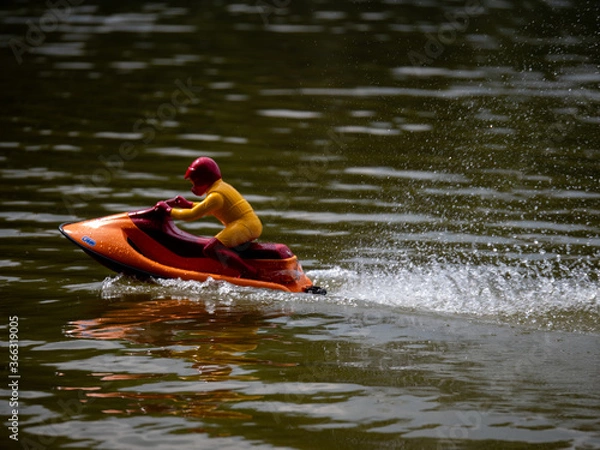 Obraz RC controlled jet ski model on lake. Active summer vacation for school child.