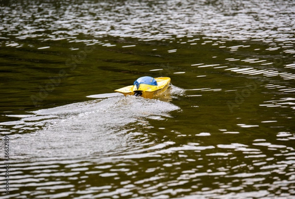 Obraz RC controlled jet boat model on lake. Active summer vacation for school child.