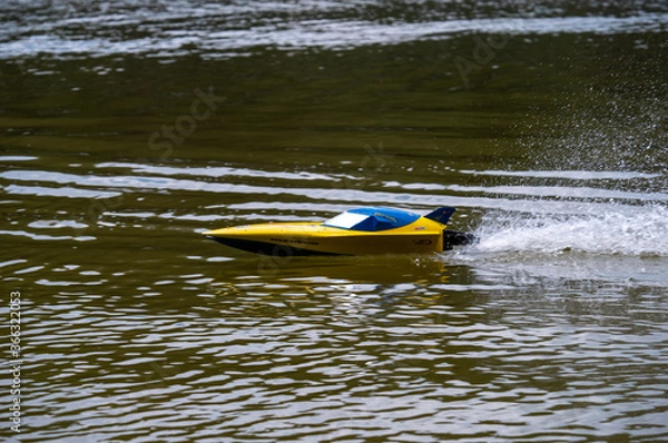 Obraz RC controlled jet boat model on lake. Active summer vacation for school child.
