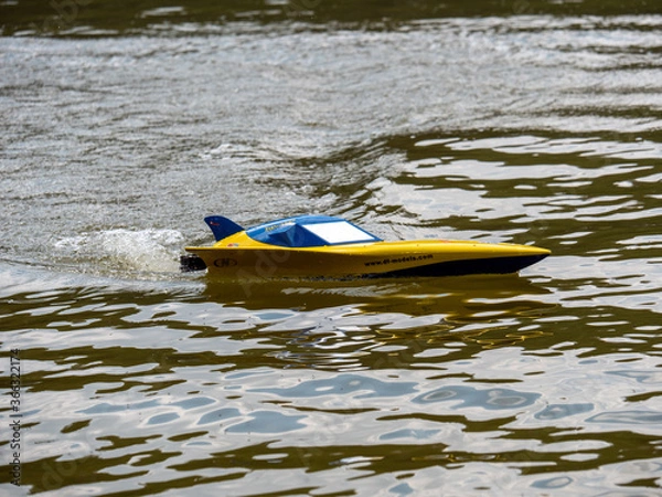 Obraz RC controlled jet boat model on lake. Active summer vacation for school child.