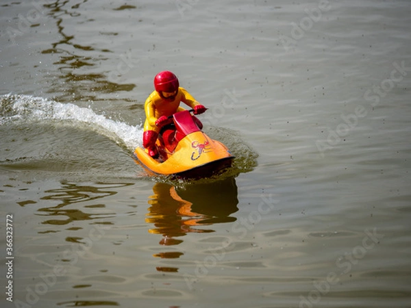 Obraz RC controlled jet ski model on lake.