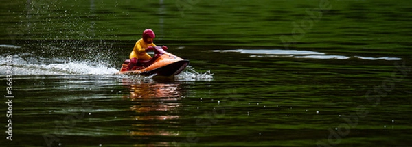 Obraz RC controlled jet ski model on lake.