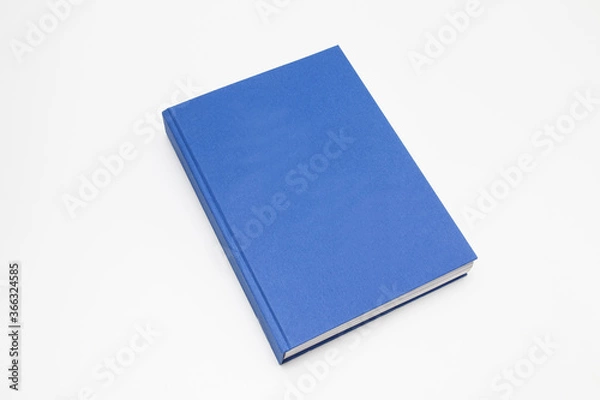 Obraz Blue book with no title standing on white background