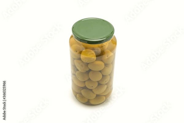 Fototapeta Olives in a bottle isolated on a white.