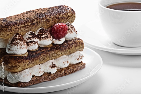 Obraz a cake with coffee on the table,