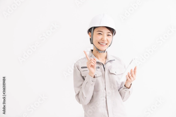 Fototapeta 作業着の女性　タブレット