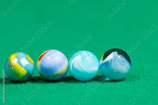 Fototapeta Colorful Marble Balls on Green background. Abstract Pattern