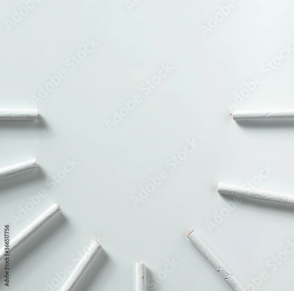Fototapeta round of cigarettes isolated on white background with copy space  from top view.concept for illness, unhealthy.