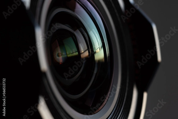 Fototapeta Close-up camera lens with color reflections