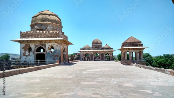Fototapeta The terrace view of Jahaz Mahal (ship building) located at Mandu region of Madhya Pradesh, India. Jahaz Mahal was built in second half of the 15th century. Jahaz Mahal best captures the history