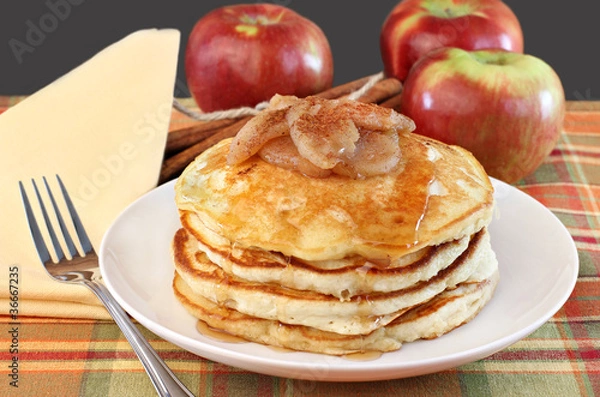Obraz Stacked pancakes with baked apples topping.