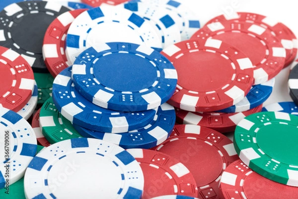 Fototapeta Playing Poker Chips laying on the table mixed together. Abstract Pattern Background