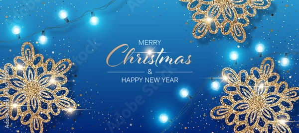 Fototapeta Christmas background with shiny snowflakes made of golden confetti and lights garlands. Design element for greeting card, party invitation or banner