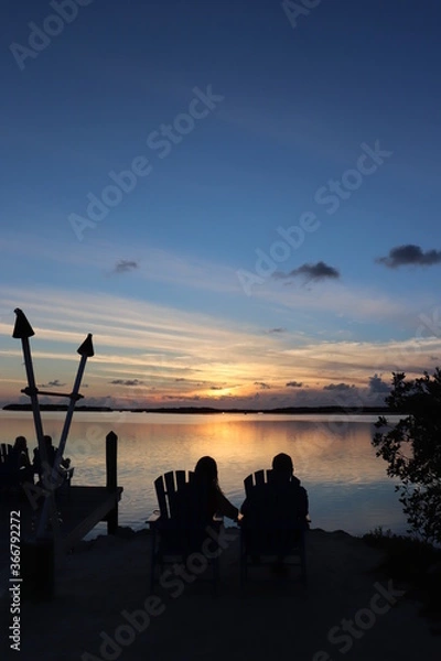 Obraz couple watching sunset on pier