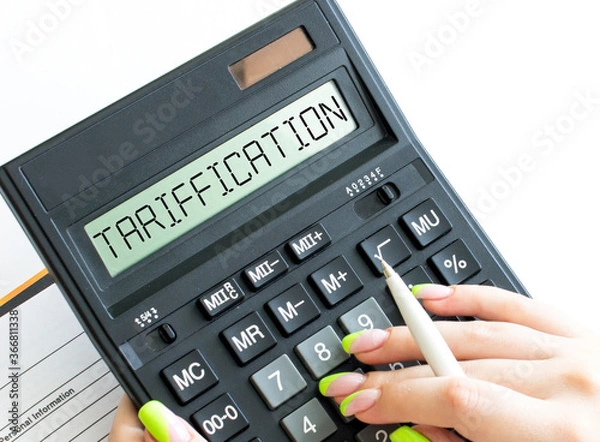 Fototapeta A calculator with text Tarification on the display
