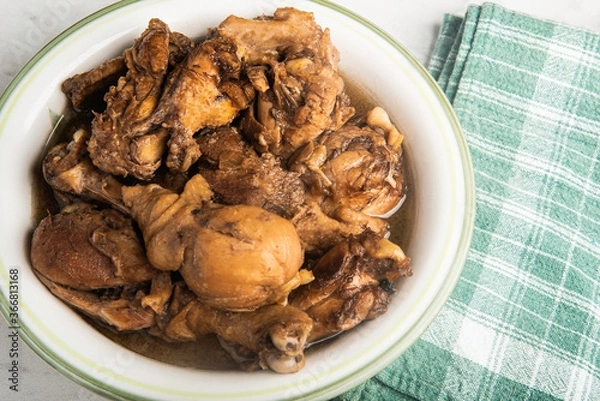 Fototapeta Filipino-Style Chicken Adobo Dish In Serving Bowl
