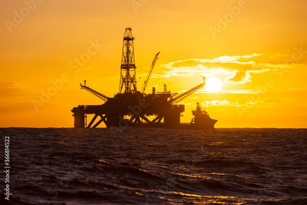 Obraz Drilling rig and supply vessel