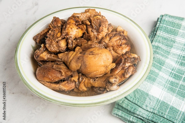 Fototapeta Filipino-Style Chicken Adobo Dish In Serving Bowl