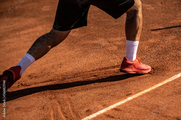 Fototapeta close-up of a foot slip on a clay tennis court