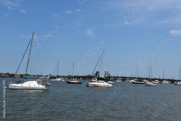 Fototapeta Sailboats and an open drawbridge on Matanzas Bay in Florida.