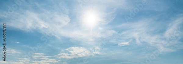 Fototapeta Sun shining through thin clouds