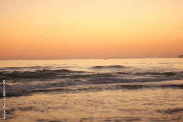 Obraz Alanya, TURKEY - August 10, 2013: Travel to Turkey. Sunset at the sea. The sun is leaving the horizon.