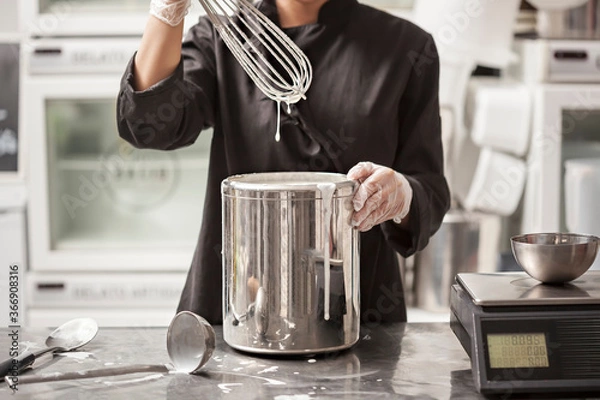 Fototapeta Making Of Ice Cream - Chef whisking ingredients