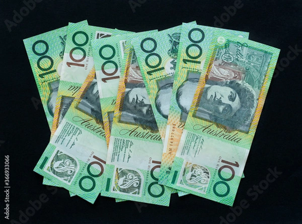 Fototapeta Australian currency 100 dollar notes on black background