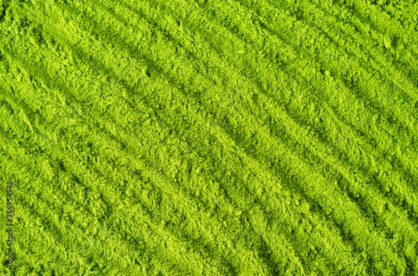 Obraz Matcha powder background. Green tea texture close up, selective focus