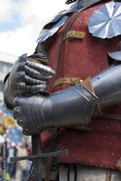 Fototapeta Knight's hands holding a sword. City festival, The Netherlands