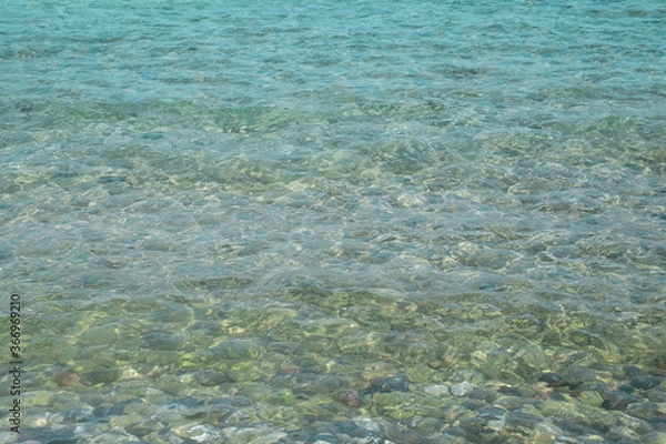 Fototapeta Acqua cristallina spiaggia con sassi di Kos. Grecia