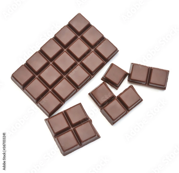 Fototapeta Chocolate bar with pieces isolated on white background. Top view, flat lay