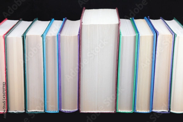 Fototapeta Books of different colours  isolated.