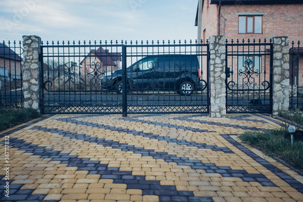 Fototapeta Stone pavement in perspective. Stone pavement texture. Granite cobblestoned pavement background. Abstract background of a cobblestone pavement