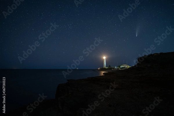 Fototapeta HDR Landscape view on famous Neowise comet over white Lighthouse at night