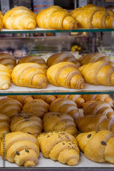 Fototapeta soft fresh croissants on the showcase