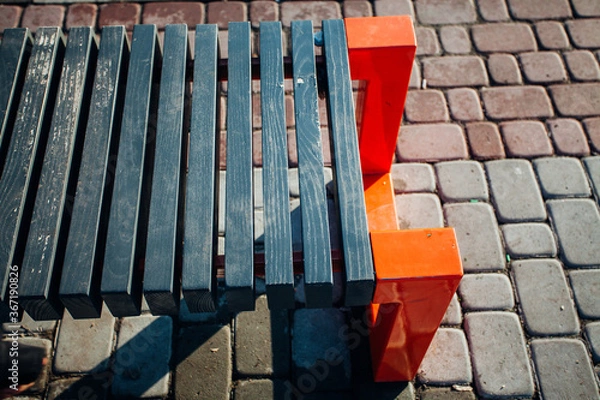 Fototapeta Nested pavers of various colors, around the grass is green, chic garden