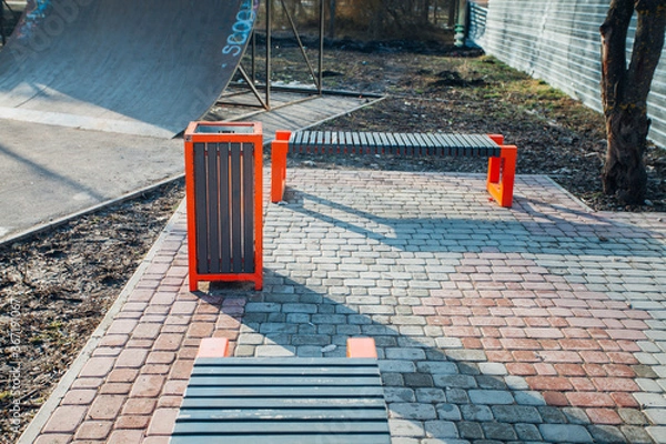 Fototapeta Nested pavers of various colors, around the grass is green, chic garden