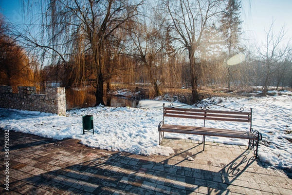 Fototapeta Nested pavers of various colors, around the grass is green, chic garden