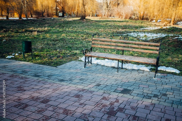 Fototapeta Nested pavers of various colors, around the grass is green, chic garden