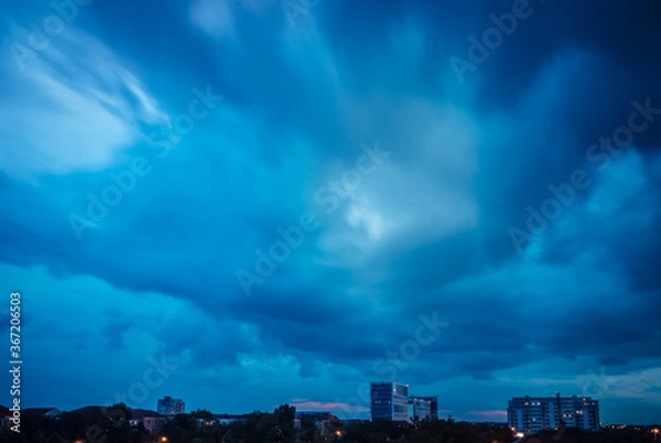 Obraz time lapse clouds over city