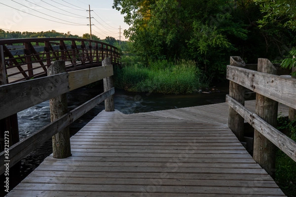 Obraz Wood deck over stream at portage creek bicentennial park in Michigan
