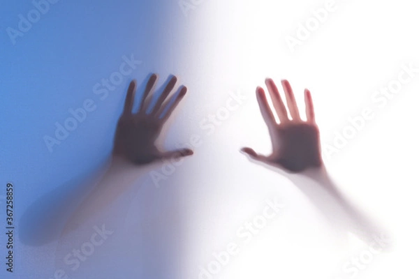 Fototapeta silhouette of the girl's palms on the fabric lighting from behind through the skylight