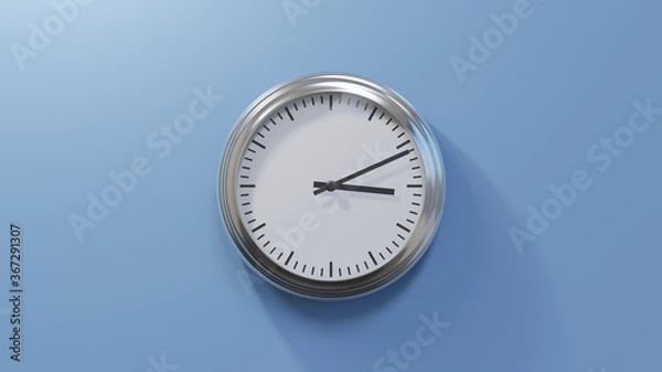Fototapeta Glossy chrome clock on a blue wall at eleven past three. Time is 03:11 or 15:11