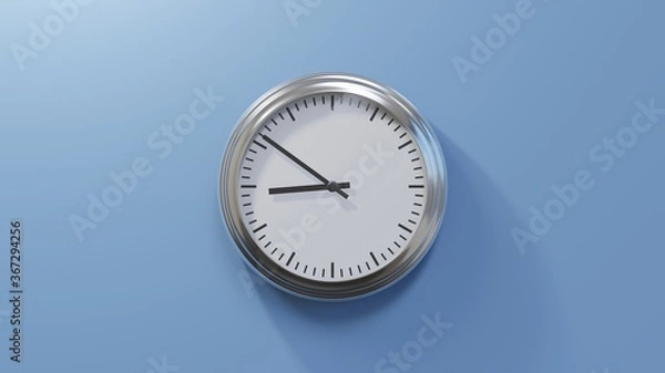 Fototapeta Glossy chrome clock on a blue wall at fifty-one past eight. Time is 08:51 or 20:51