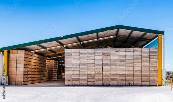 Fototapeta Piles of crates in agricultural building - Te Puke, Bay of Plenty, North Island, New Zealand