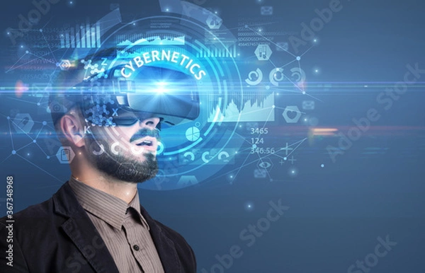 Fototapeta Businessman looking through Virtual Reality glasses with CYBERNETICS inscription, innovative technology concept