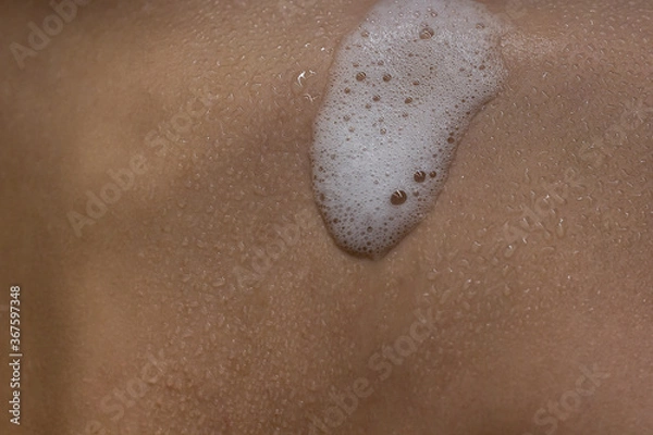 Obraz Close-up of shower foam and water drops on human skin. 